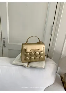 Metallic gold minimalist retro small square handbag with padded circle details