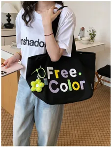 Casual large capacity black canvas tote bag with colorful embroidery and floral charm.