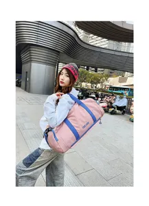 Large capacity pink travel duffel bag with blue straps for outdoor fitness and sports.