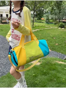 Colorful color block travel duffel bag, large capacity sports gym bag for women outdoor fitness.