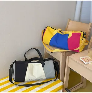 Large capacity travel duffel bag for women, trendy color block weekend fitness sports bag.
