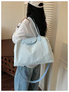 Large capacity travel bag with cute bow embroidery, casual shoulder tote for women daily travel.