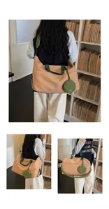 Large capacity travel duffel bag with green straps and coin purse for short trips and gym.