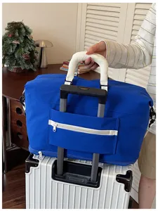 Large capacity travel duffel bag with trolley sleeve and handle wrap for weekend trips.