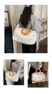 Large capacity canvas travel duffel bag with orange handles for women fitness gym weekend.
