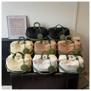 Detailed view of large-capacity travel duffel bags in multiple colors with matching pouches.