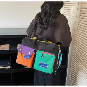 Bolsa de viaje colorida con multiples bolsillos, bolso de hombro casual para viajes cortos.