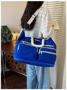 Large capacity travel duffel bag for short trips, lightweight gym sports bag with multiple pockets.