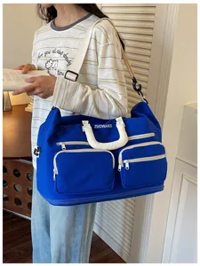 Large capacity travel duffel bag for short trips, portable luggage shoulder bag detail view.