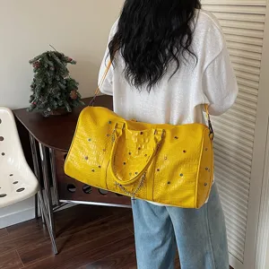 Große gelbe Kroko-Reisetasche mit Strasssteinen und einer schönen Kreuz-Kette für Damen.