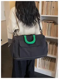 Large capacity travel duffel bag with green handle, lightweight gym bag for outdoor.