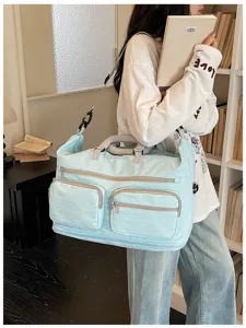 Large capacity travel duffel bag with multiple pockets for sports, fitness and short business trips.
