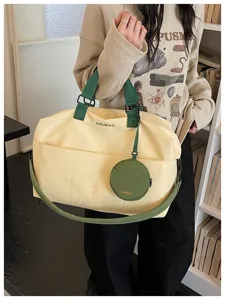 Large capacity travel duffel bag with portable handle and shoulder strap for short trips.