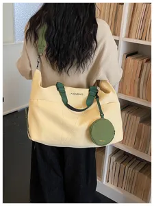 Large capacity travel duffel bag for women, lightweight canvas weekender bag with shoulder strap