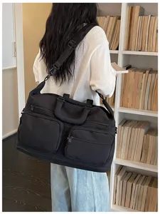 Large capacity travel duffel bag detail, multi-pocket design, daily lifestyle scene view.