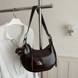 Premium dark brown crescent hobo shoulder bag with a unique triangular metal buckle
