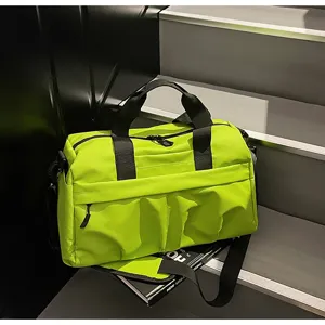 Green large capacity travel duffel bag with adjustable shoulder strap for fitness and gym.