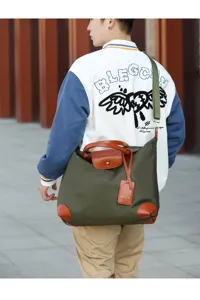 Casual canvas shoulder bag for men and women, stylish travel luggage tote with top handle.