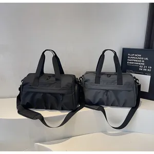 Large capacity gym bag and travel duffel in black and grey, modern minimalist display detail.
