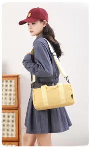 Small yellow gym duffel bag for women, waterproof sports bag for yoga and travel fitness.