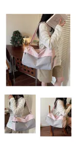 Large capacity pink and grey travel duffel bag for women, lightweight gym and weekend bag.