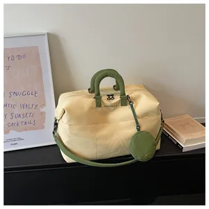 Borsa da viaggio in tela con manici verdi e tasca rotonda per allenamento in palestra.