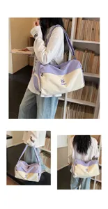 Casual canvas travel duffel bag with large capacity, dual shoulder and handheld straps for short trips.