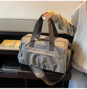 Large capacity grey travel duffel bag for fitness and short trips with shoe compartment.
