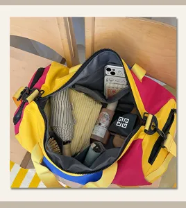 Trendy colorblock travel duffel bag with large capacity, lightweight design for short trips.