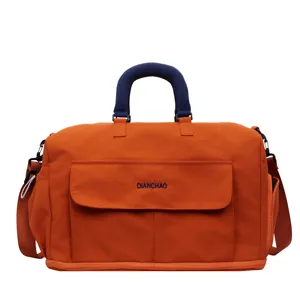 Large capacity travel duffel bag with shoulder strap, durable orange canvas overnight bag.