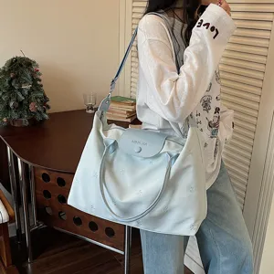 Large capacity travel duffel bag with stylish bow embroidery, lightweight and convenient.