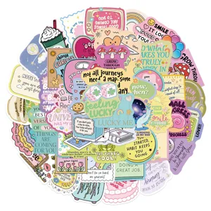 Close-up detail of assorted cute positive affirmation waterproof stickers with inspiring quotes.