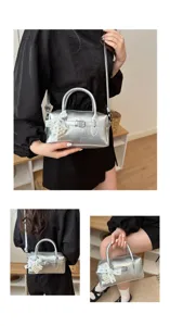 Silberne Bowling-Handtasche mit dekorativer Perlen-Spitzenschleife und verstellbarem Riemen