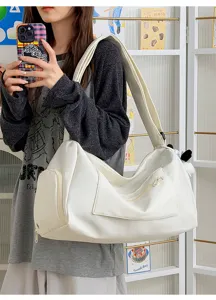 Large capacity white travel duffel bag lightweight shoulder gym bag for women daily use.