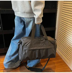 Detail view of large capacity travel duffel bag with shoe compartment for gym sports.