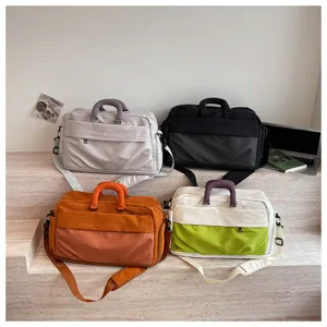 Large capacity travel duffel bag for women, multi-pocket canvas shoulder gym luggage bag.