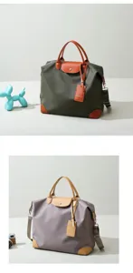 Nylon travel duffel bag with leather trim, stylish casual weekender handbag for men and women.