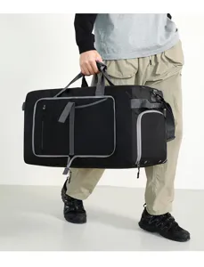 Detail shot of the large black travel duffel bag showcasing its spacious interior structure.