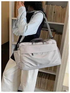 Large capacity travel duffel bag for women, expandable short trip luggage gym bag with strap.