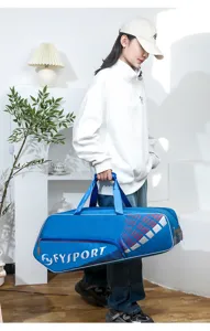 Large capacity blue badminton tennis racket bag with hand strap, outdoor sports storage.