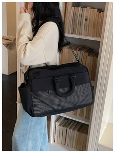 Large capacity travel duffel bag for women, expandable weekend luggage bag with shoulder strap.