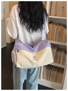 Large capacity canvas travel duffel bag with contrast color design, casual style for daily use.