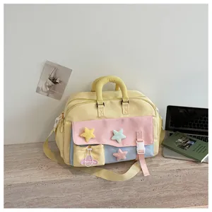 Pastel color travel gym bag featuring cute plush stars and a handy front pocket detail.
