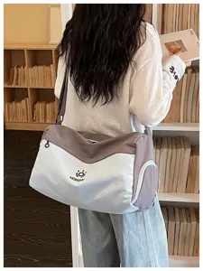 Large capacity travel duffel bag for women, casual canvas overnight gym bag with strap.
