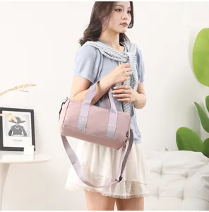 Stylish cylindrical fitness gym bag for women, waterproof casual yoga travel duffel.