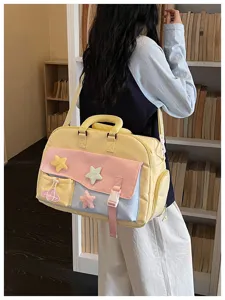 Casual canvas shoulder bag detail, multi-color panel design with cute plush stars.