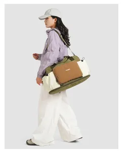 Colorblock travel duffle bag with wet dry compartment and nylon material for outdoor sports.