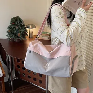 Large capacity pink and grey travel duffel bag with shoulder strap for short trips