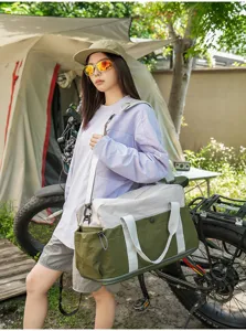 Large capacity travel duffel bag with two-tone design, lightweight outdoor camping gear.
