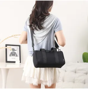 Mini black gym duffel bag for women, waterproof short trip travel shoulder bag.